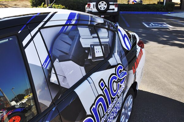 2013_Nissan_Versa_Wrap_3__82384.1412637576